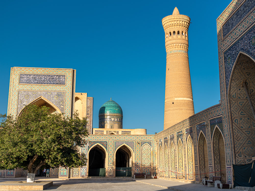 JUNE 27, 2023, BUKHARA, UZBEKISTAN: Inner courtyard of the Kalyan Mosque, part of the Po-i-Kalyan Complex in Bukhara, Uzbekistan. Sunset sky with copy space for text