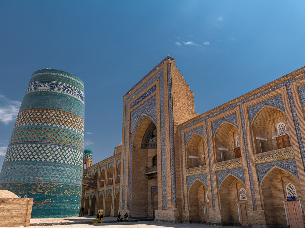 Kalta minaret left, muhammad amin khan madrasah to the right, ichon qala, Khiva, Uzbekistan. Close up image